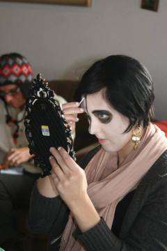 Madi Culp, artist facilitator, demonstrating face-painting calavera style makeup.
